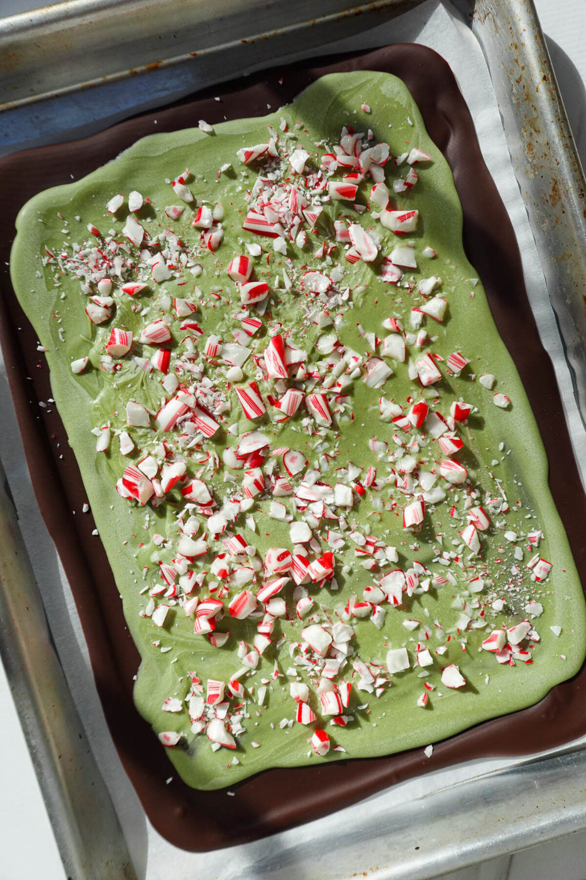 Matcha peppermint bark topped with crushed candy canes.