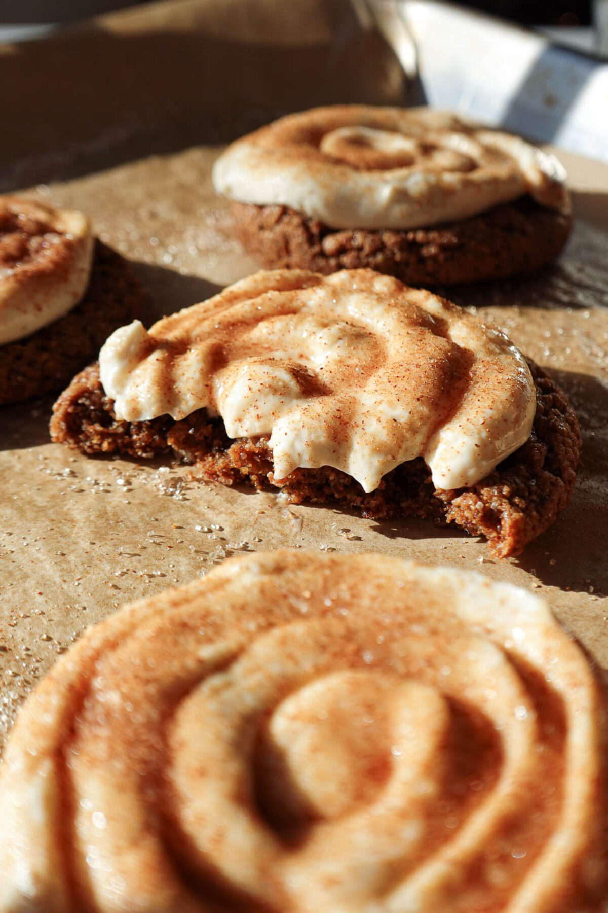 Close-up of vegan Crumbl churro cookies with a bite taken out