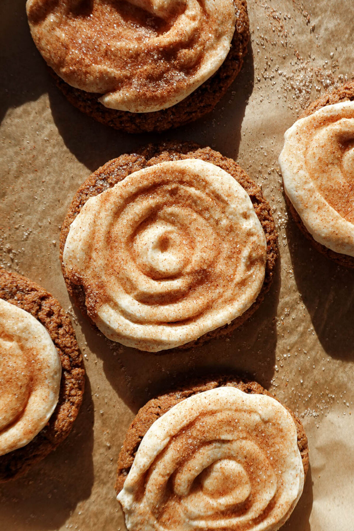 Vegan and gluten-free Crumbl churro cookies topped with creamy swirls and cinnamon sugar