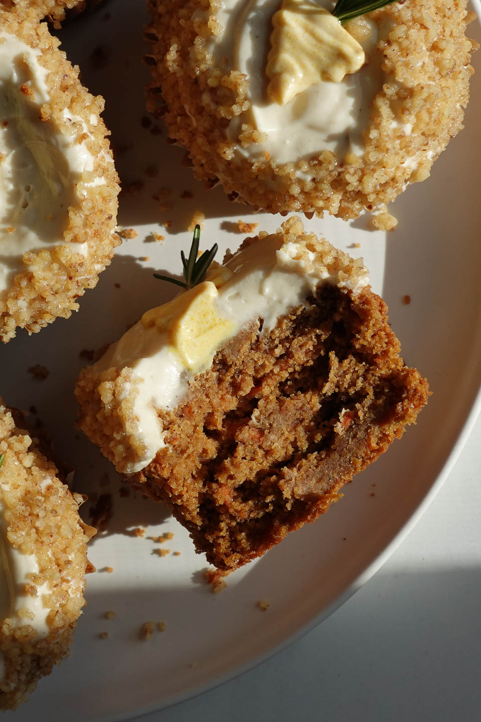 Inside view of a tender carrot cake muffin made vegan and gluten-free