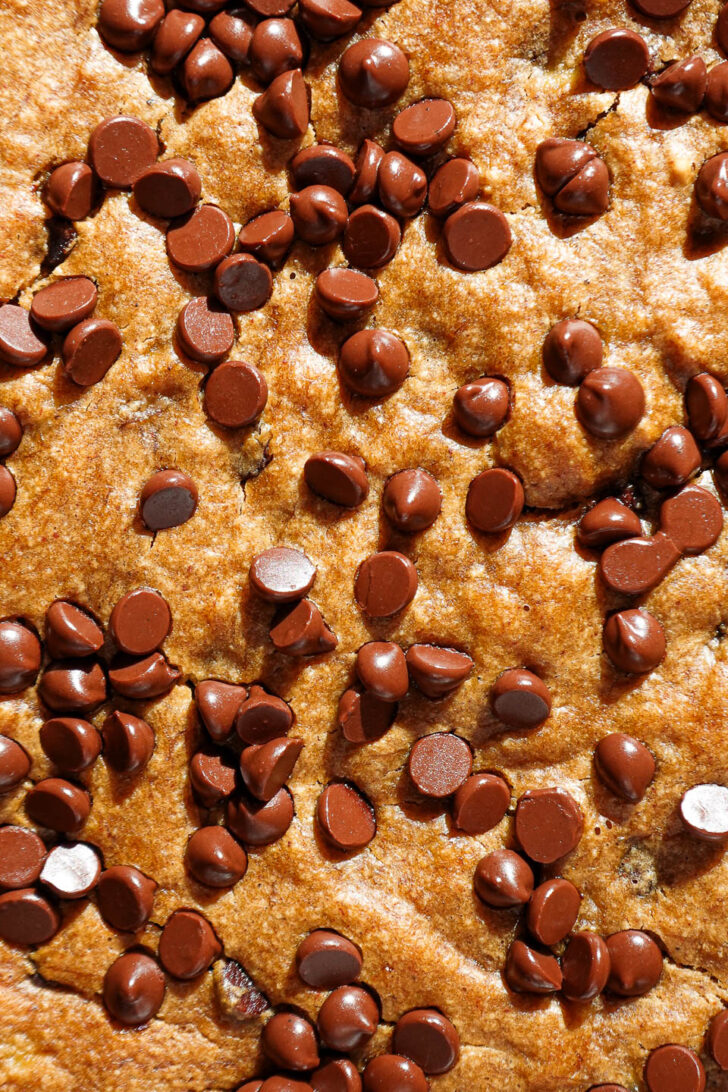 close-up of vegan banana bars before slicing with glowing mini chocolate chips
