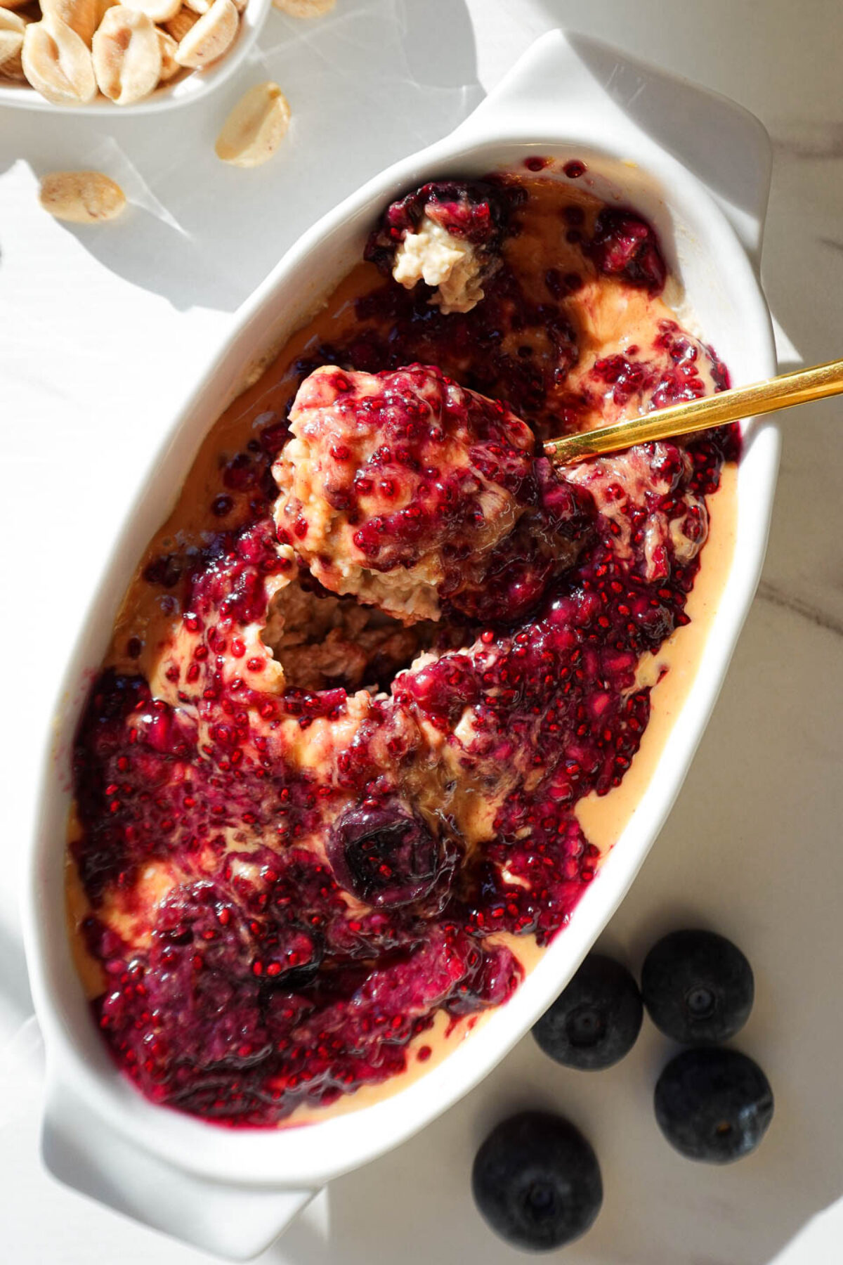 spoonful of peanut butter & jelly overnight oats with creamy texture