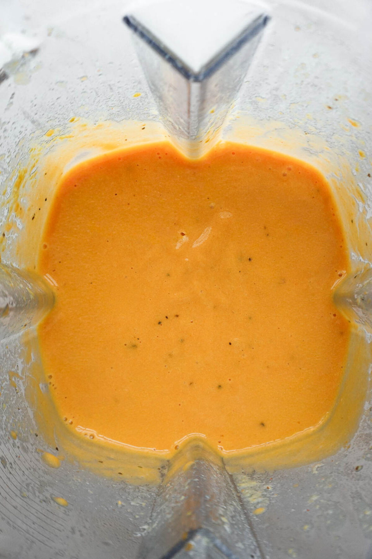 Blending dairy-free cheese sauce made from vegetables