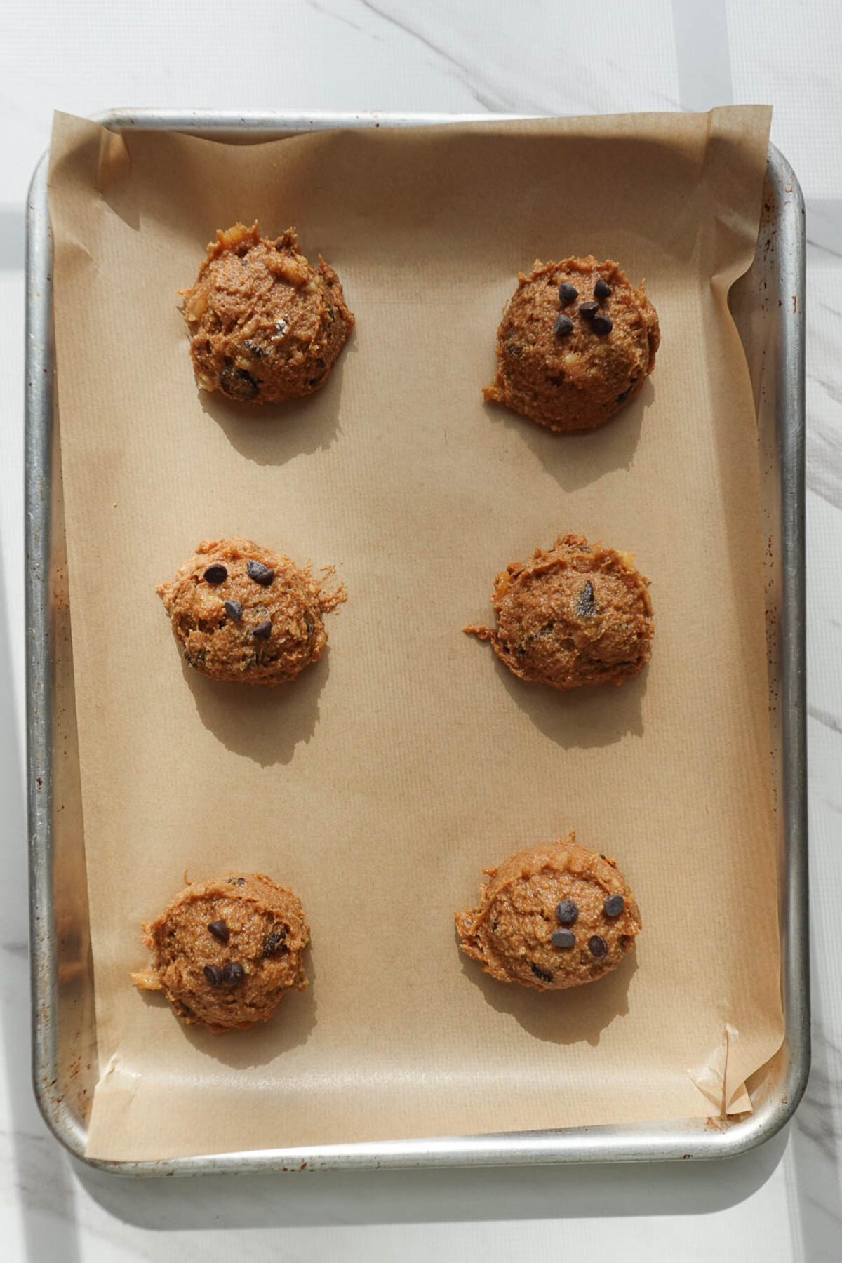 vegan banana cookies on baking sheet before baking