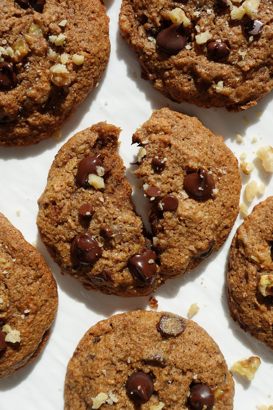 vegan banana bread cookies cut in half showing soft and chewy texture