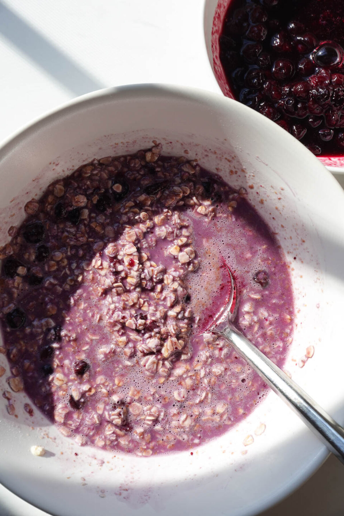 vibrant purple color from blueberry overnight oats in a bowl