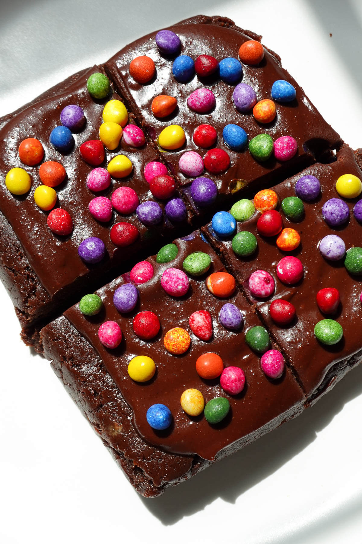 No bake cosmic brownie sliced into 4 pieces.
