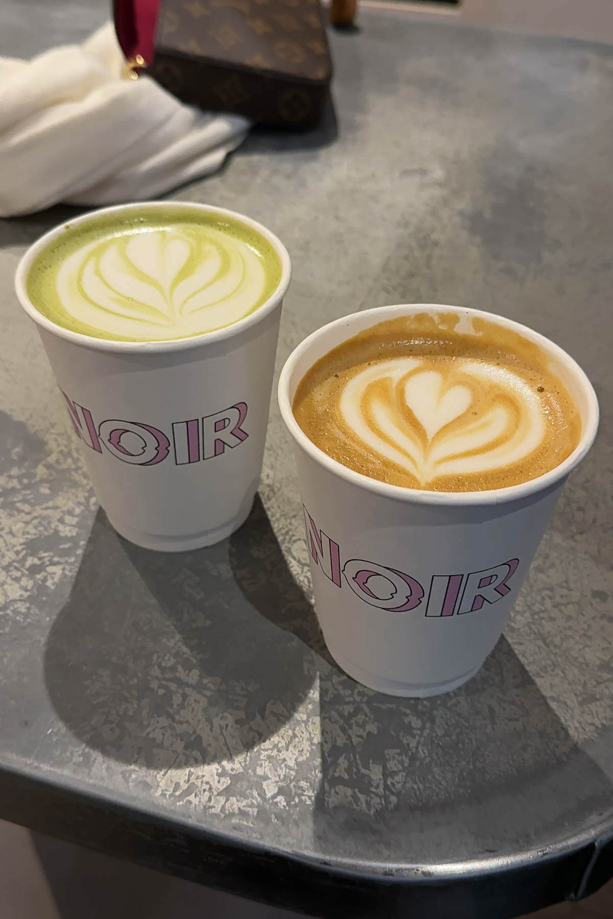 Matcha latte and hot latte from Cafe Noir in Paris