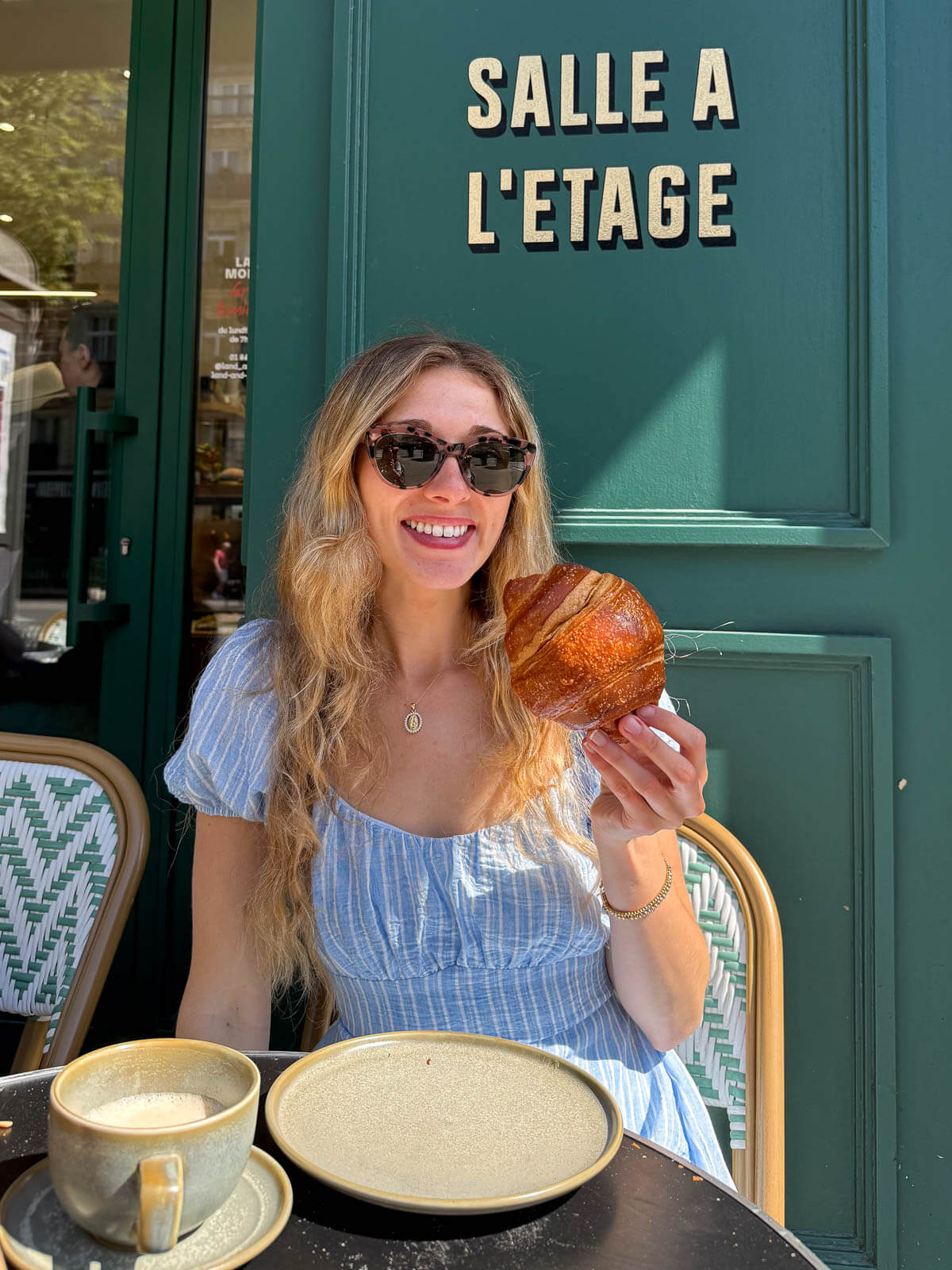 Megan holding a vegan croissant