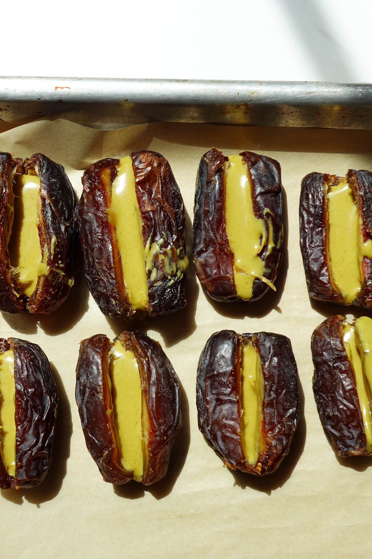 Filling medjool dates with creamy pistachio butter.