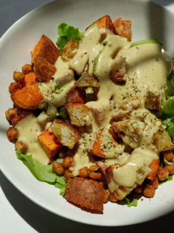 Sweet potato chickpea salad tossed in a creamy vegan honey mustard dressing.