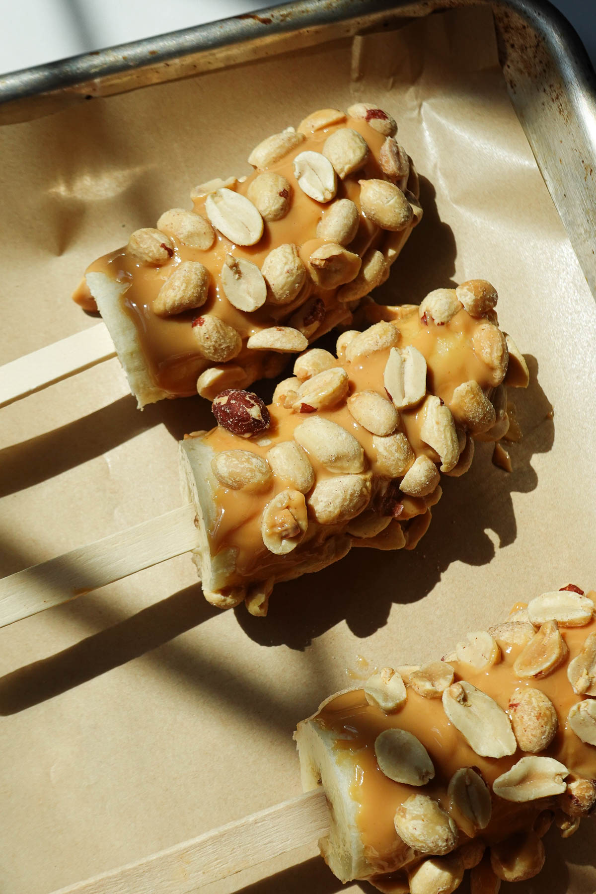 Frozen banana pops before dipping in melted chocolate.