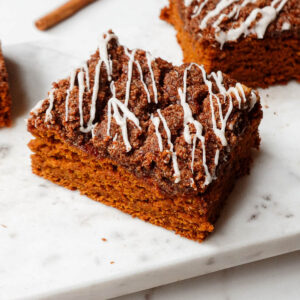 Vegan pumpkin coffee cake on a marble plate.
