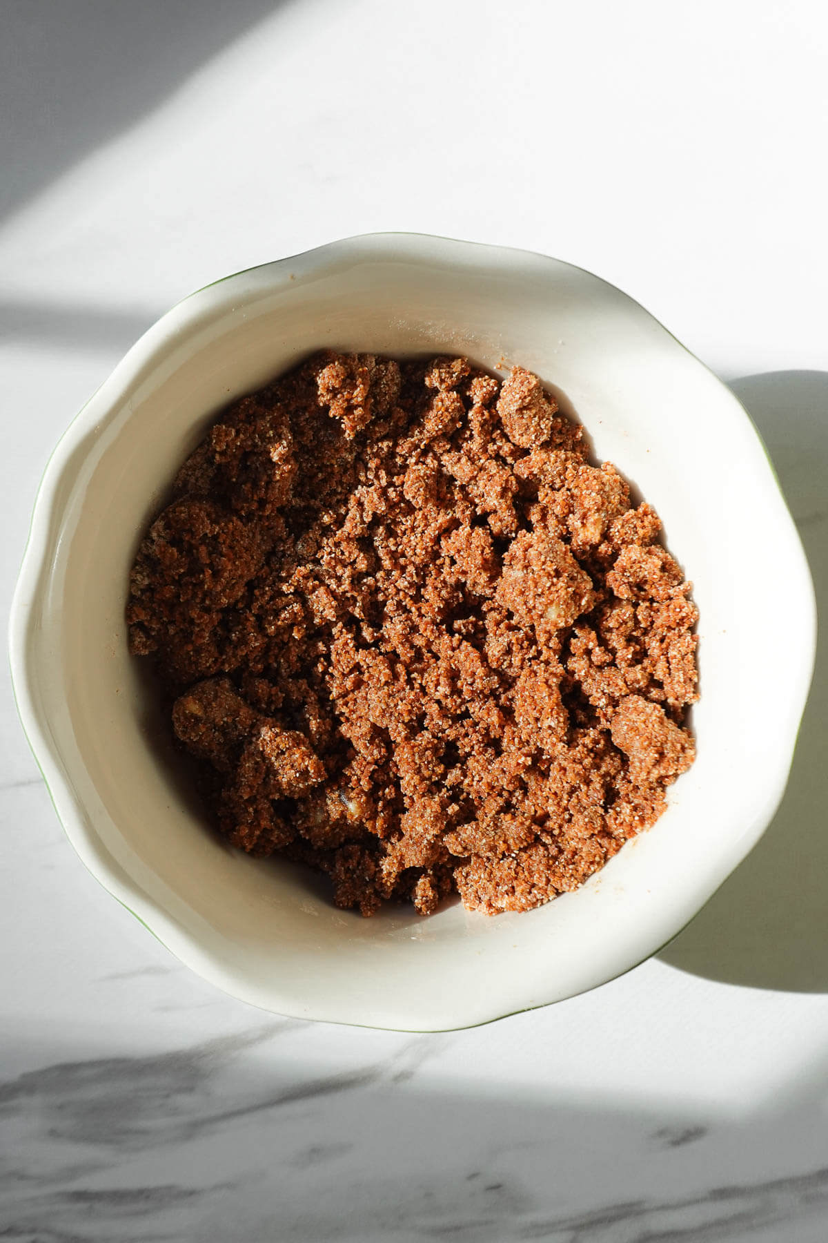Cinnamon-walnut streusel mixed together in a bowl.