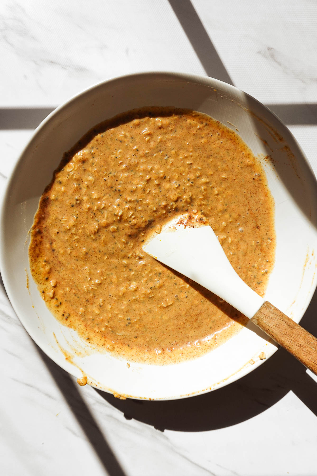 Mixing pumpkin pie overnight oat mixture.